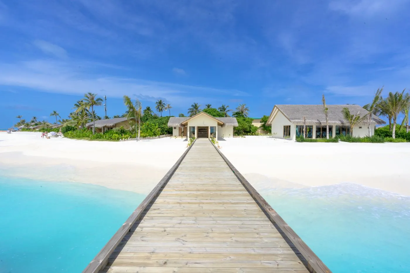 Representative island boardwalk leading toward beachfront accommodation